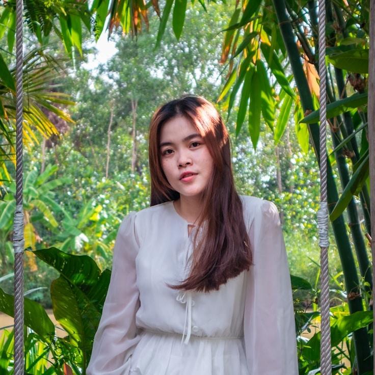 Avery Singh, Lead Design Curator at Dawn Meadow Flow, reviewing corporate floral arrangements